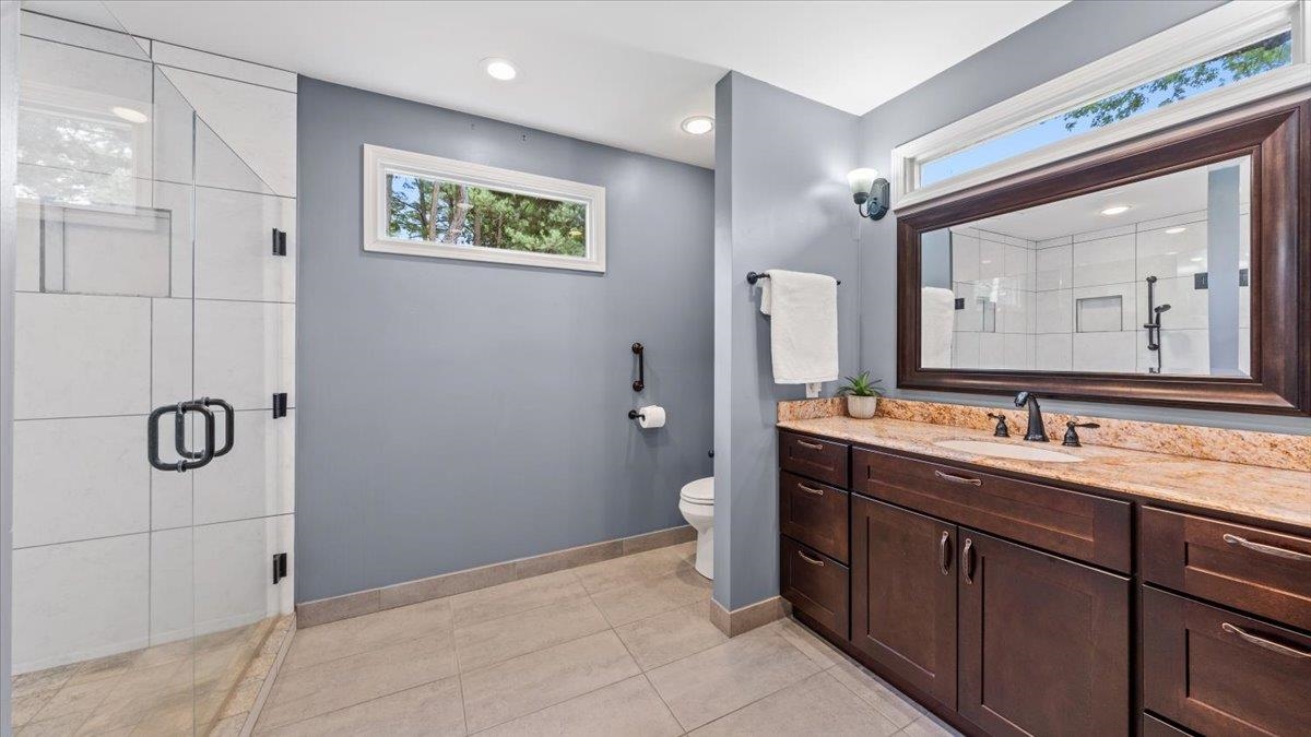 1601 Wynne Road Cordova, TN 38016 - Photo 5 of 31 a bathroom with a toilet sink and mirror