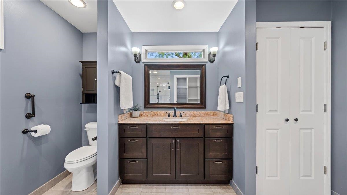 1601 Wynne Road Cordova, TN 38016 - Photo 6 of 31 a bathroom with a granite countertop toilet sink and mirror