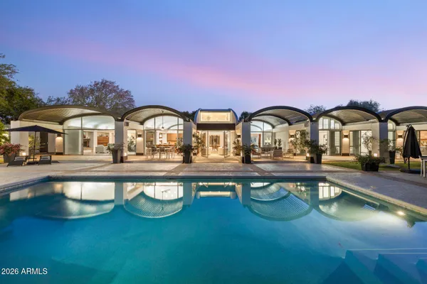 a front view of house with yard and outdoor seating