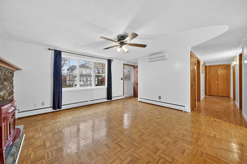 33 Isleboro Street Worcester, MA 01606 - Photo 11 of 36 a view of an empty room with a ceiling fan