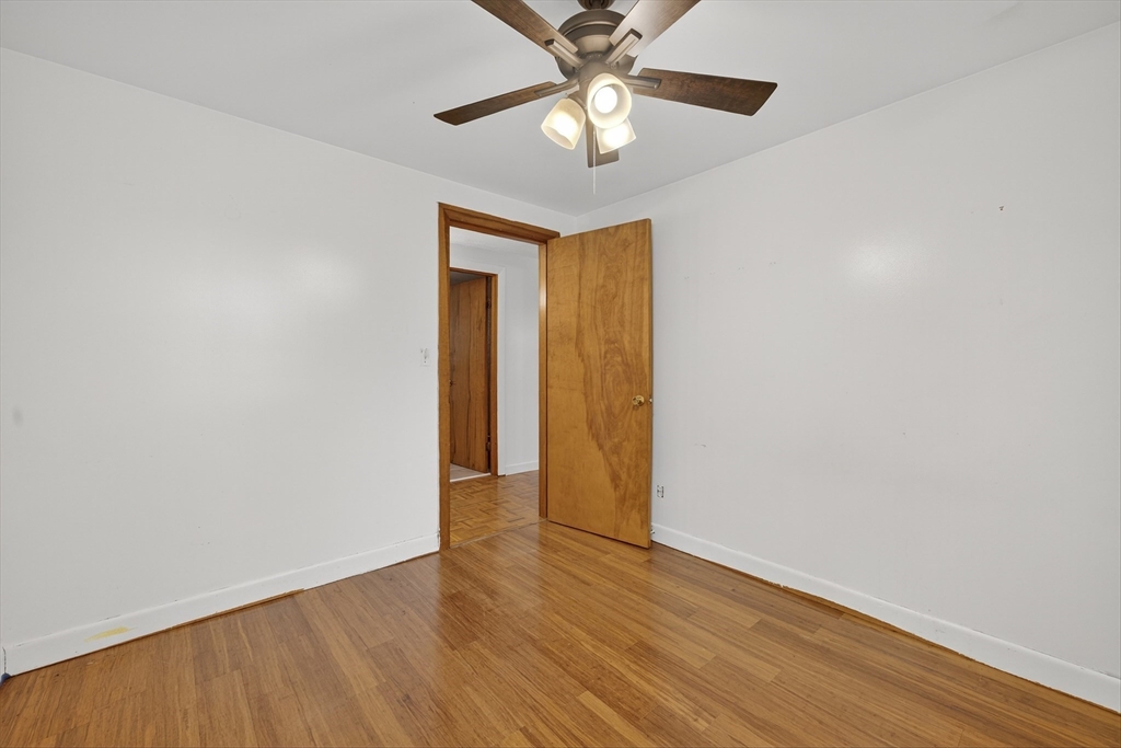 33 Isleboro Street Worcester, MA 01606 - Photo 23 of 36 a view of an empty room with wooden floor