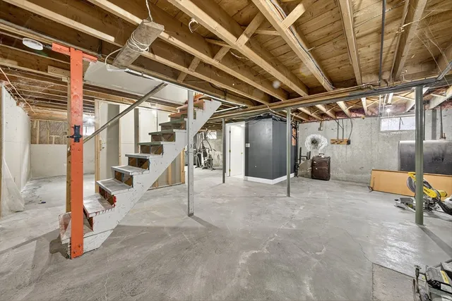 a view of an empty room with stairs