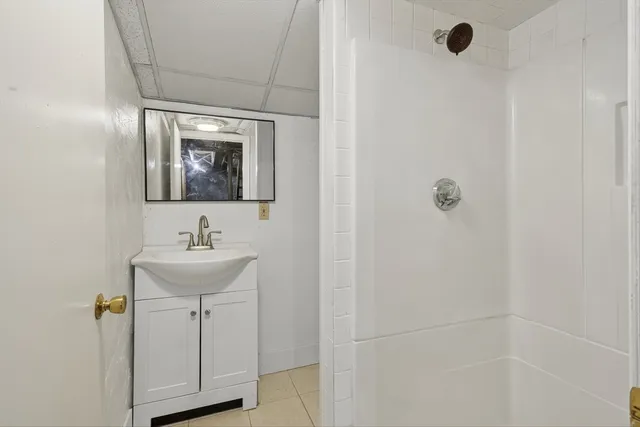 a bathroom with a sink and mirror