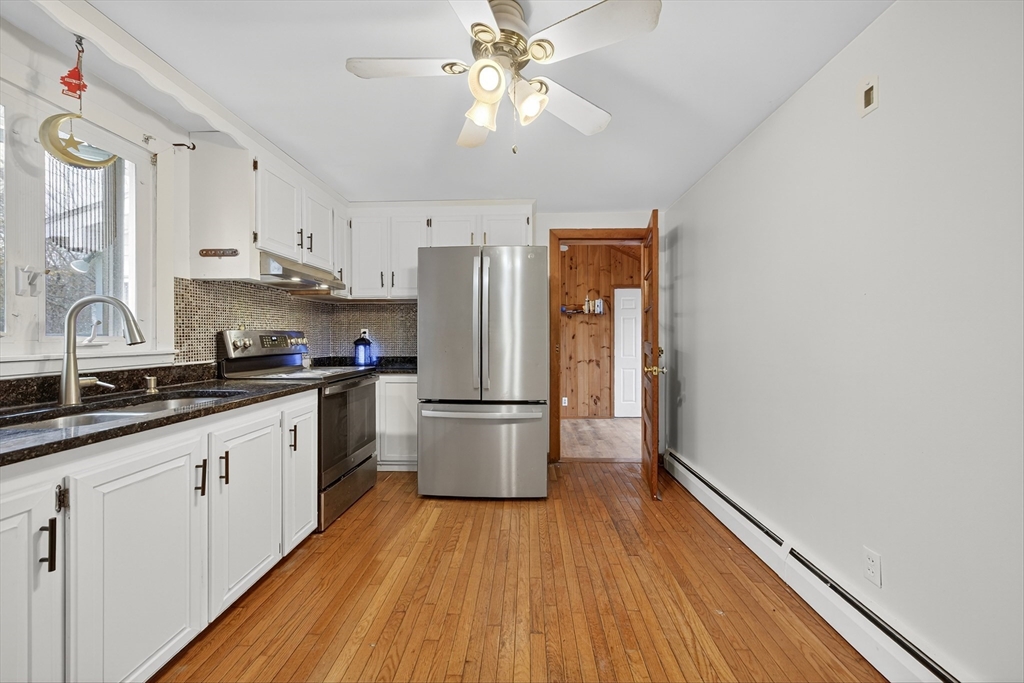 33 Isleboro Street Worcester, MA 01606 - Photo 4 of 36 a kitchen with a refrigerator and a sink