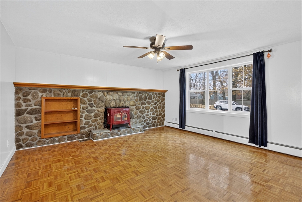 33 Isleboro Street Worcester, MA 01606 - Photo 9 of 36 a view of a livingroom with a fireplace and window