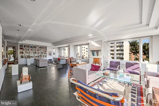 view of hall way with mirror and furniture