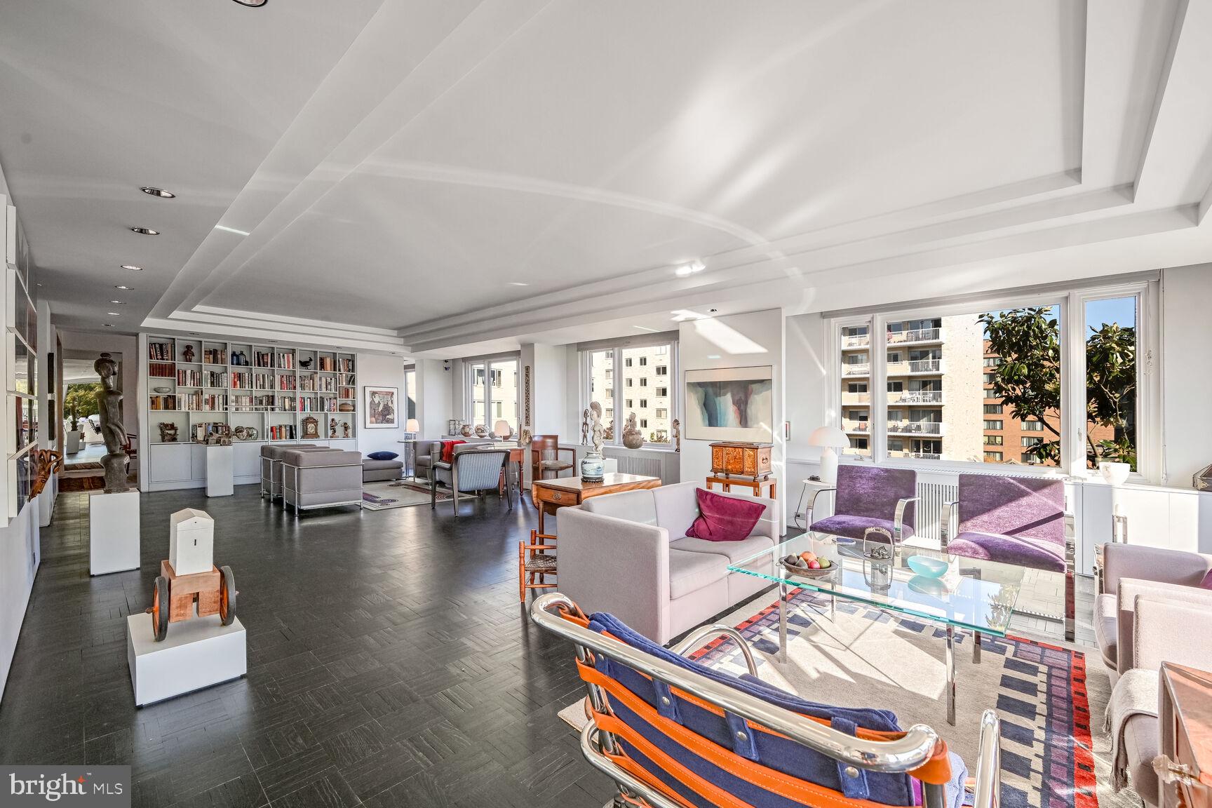 2475 Virginia Avenue Northwest, Unit 621 Washington, DC 20037 - Photo 14 of 49 a living room with furniture and a large window