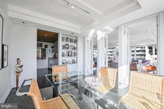 a kitchen with stainless steel appliances a sink a stove and cabinets