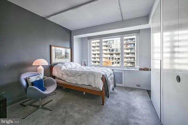 a bed room with a bed furniture and a fireplace