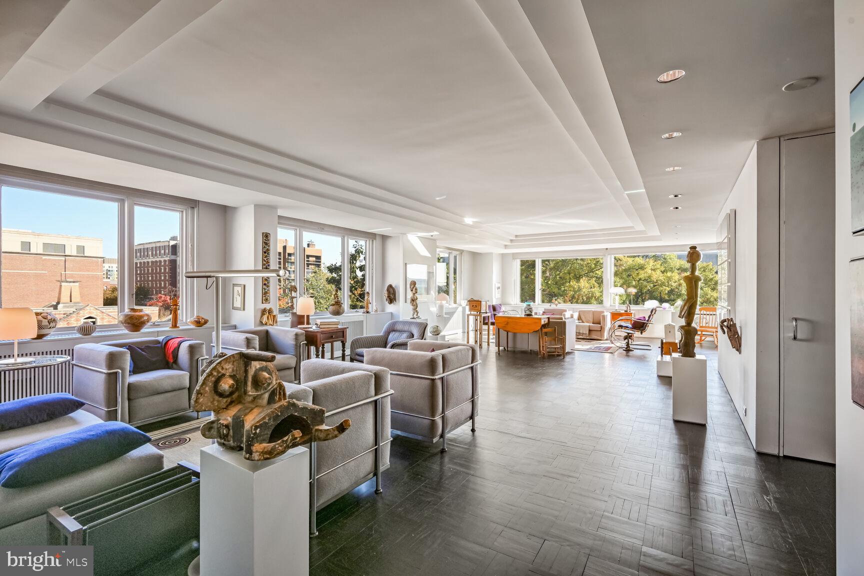 2475 Virginia Avenue Northwest, Unit 621 Washington, DC 20037 - Photo 7 of 49 a living room with furniture and a large window