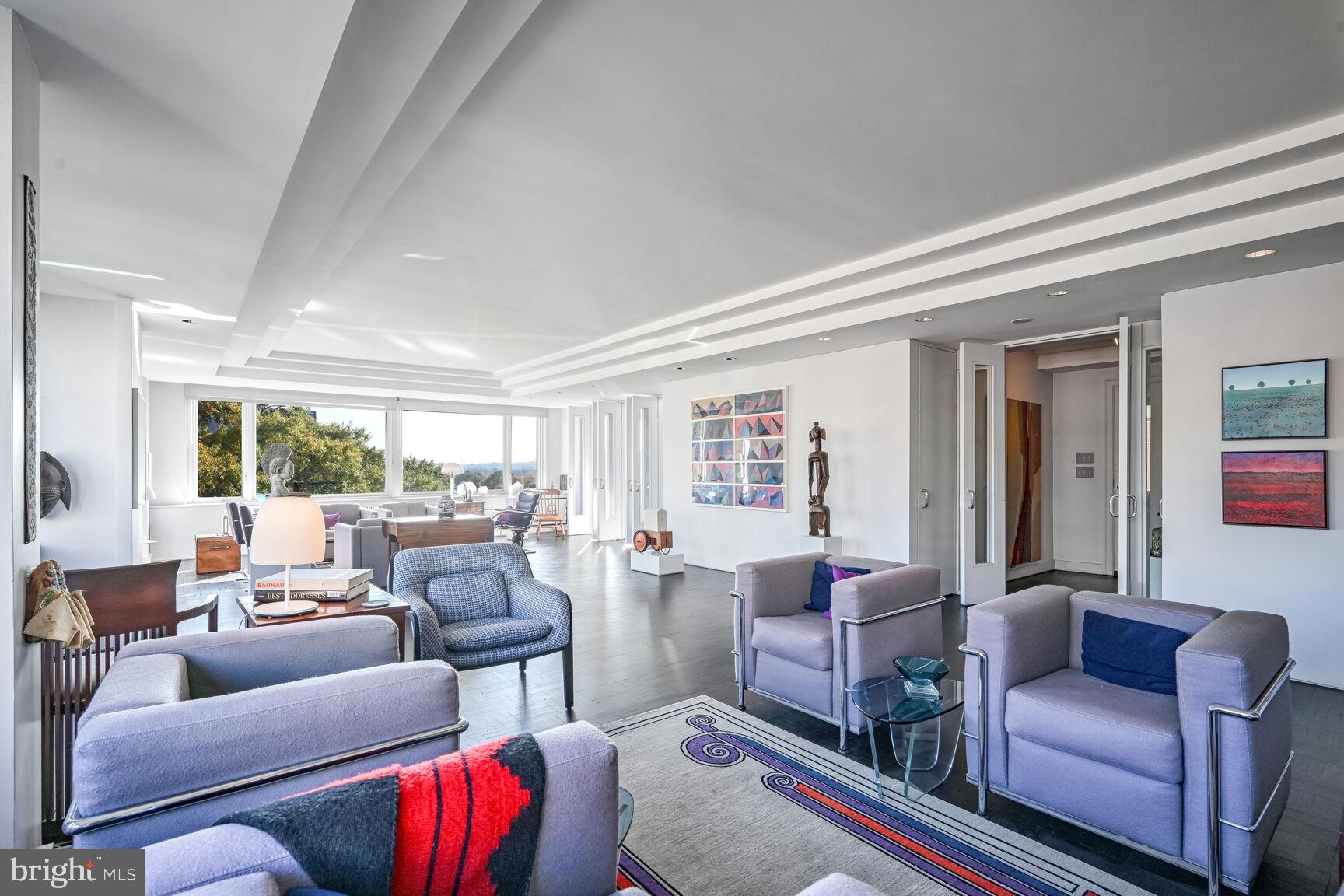 2475 Virginia Avenue Northwest, Unit 621 Washington, DC 20037 - Photo 8 of 49 a living room with furniture and a large window