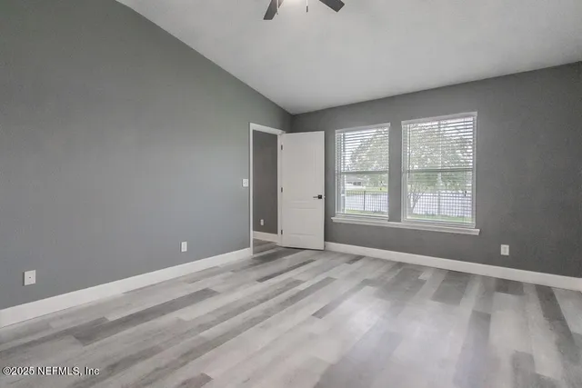 a view of an empty room with a window