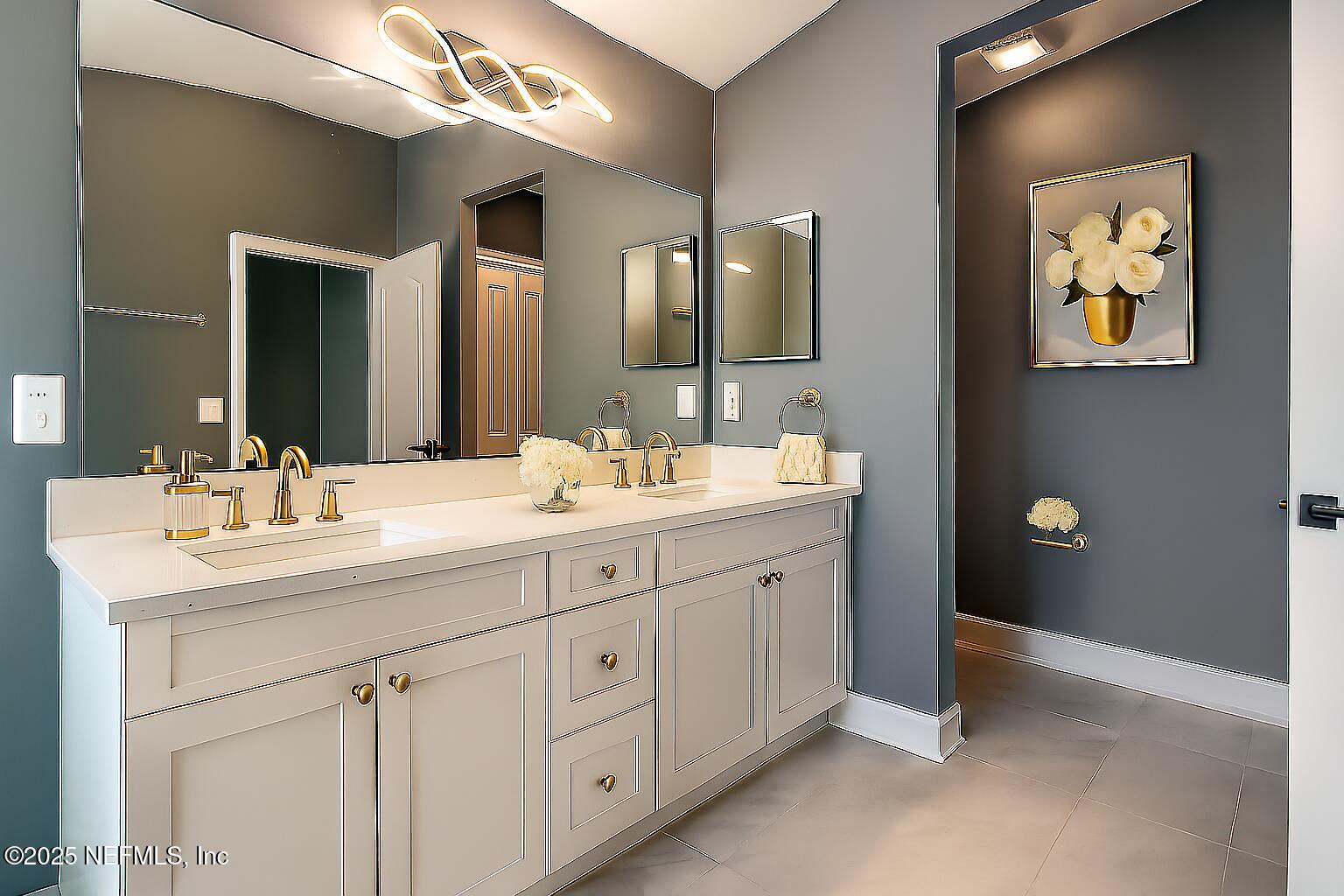 1751 Hollow Glen Drive Middleburg, FL 32068 - Photo 14 of 23 a bathroom with a double vanity sink and a mirror