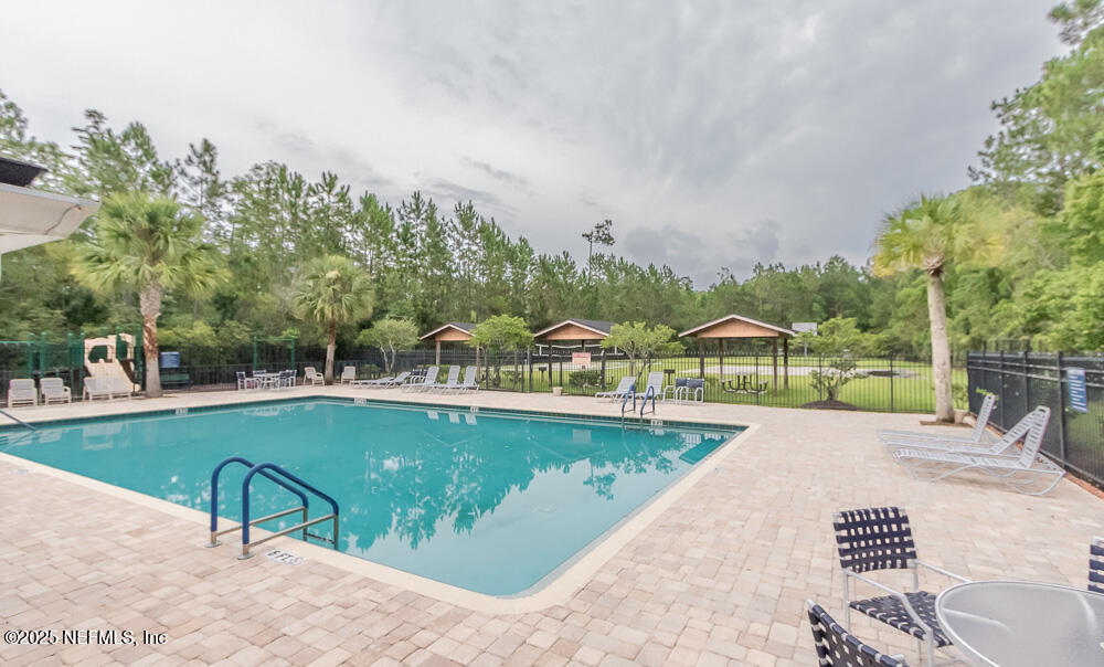 1751 Hollow Glen Drive Middleburg, FL 32068 - Photo 21 of 23 a view of a swimming pool with a patio