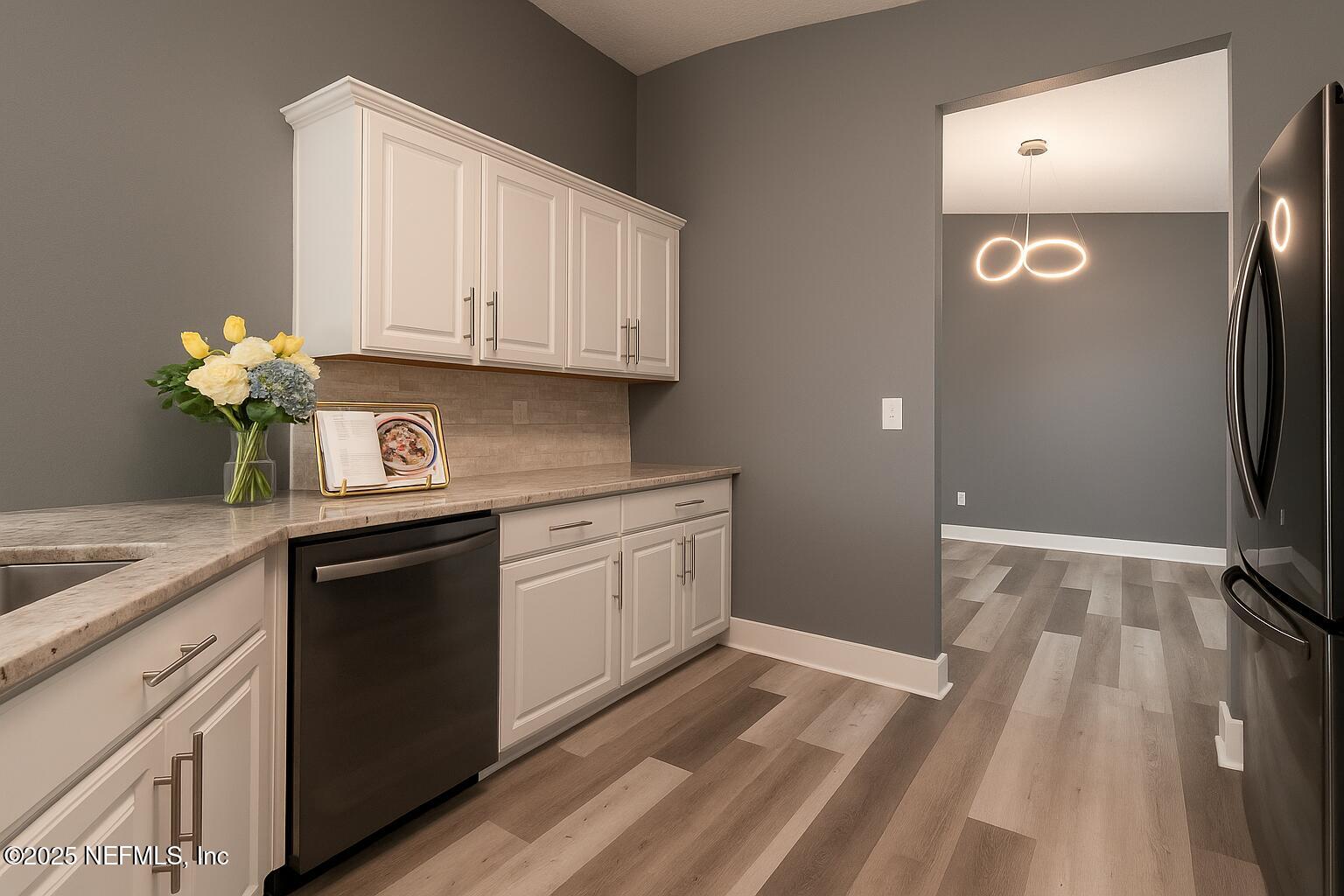 1751 Hollow Glen Drive Middleburg, FL 32068 - Photo 6 of 23 a kitchen with granite countertop cabinets stainless steel appliances and a counter space