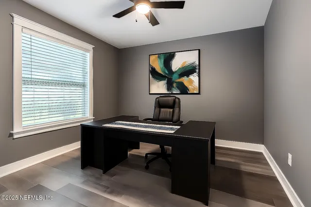 a view of a workspace with furniture