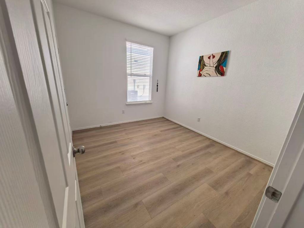 1521 Hope Rnch Road Leander, TX 78641 - Photo 12 of 15 Unfurnished room featuring light wood-type flooring and baseboards