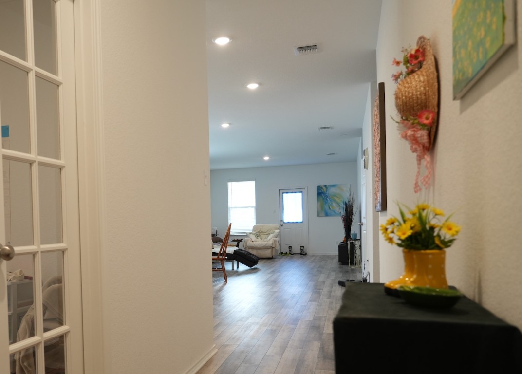 1521 Hope Rnch Road Leander, TX 78641 - Photo 3 of 15 Hallway with wood finished floors and recessed lighting