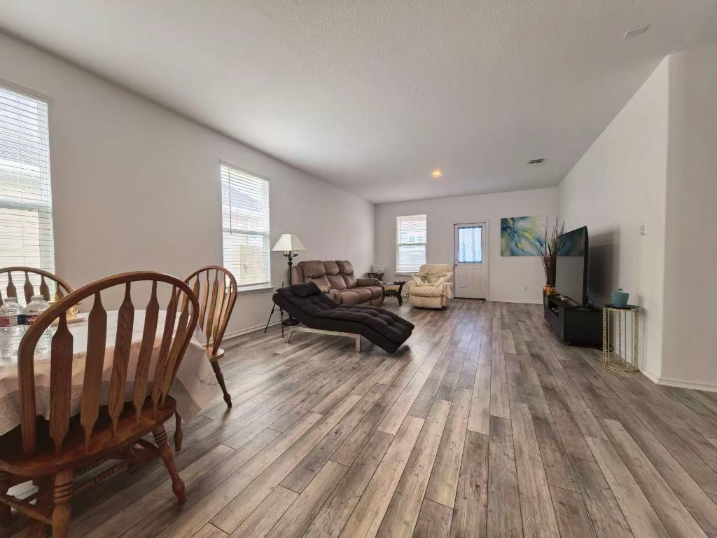 1521 Hope Rnch Road Leander, TX 78641 - Photo 4 of 15 Living room featuring hardwood / wood-style floors and baseboards