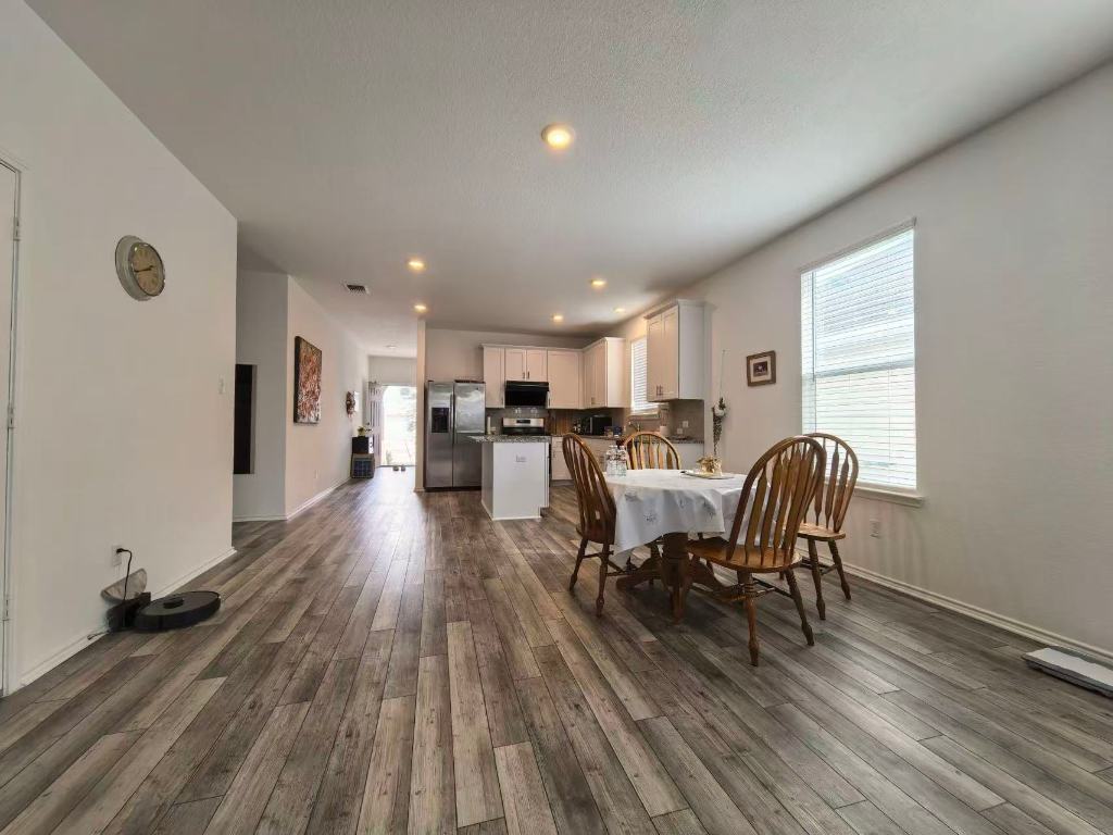 1521 Hope Rnch Road Leander, TX 78641 - Photo 5 of 15 Dining area featuring plenty of natural light, dark wood-style flooring, and recessed lighting