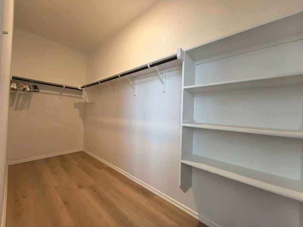 1521 Hope Rnch Road Leander, TX 78641 - Photo 10 of 15 Spacious closet featuring light wood-type flooring
