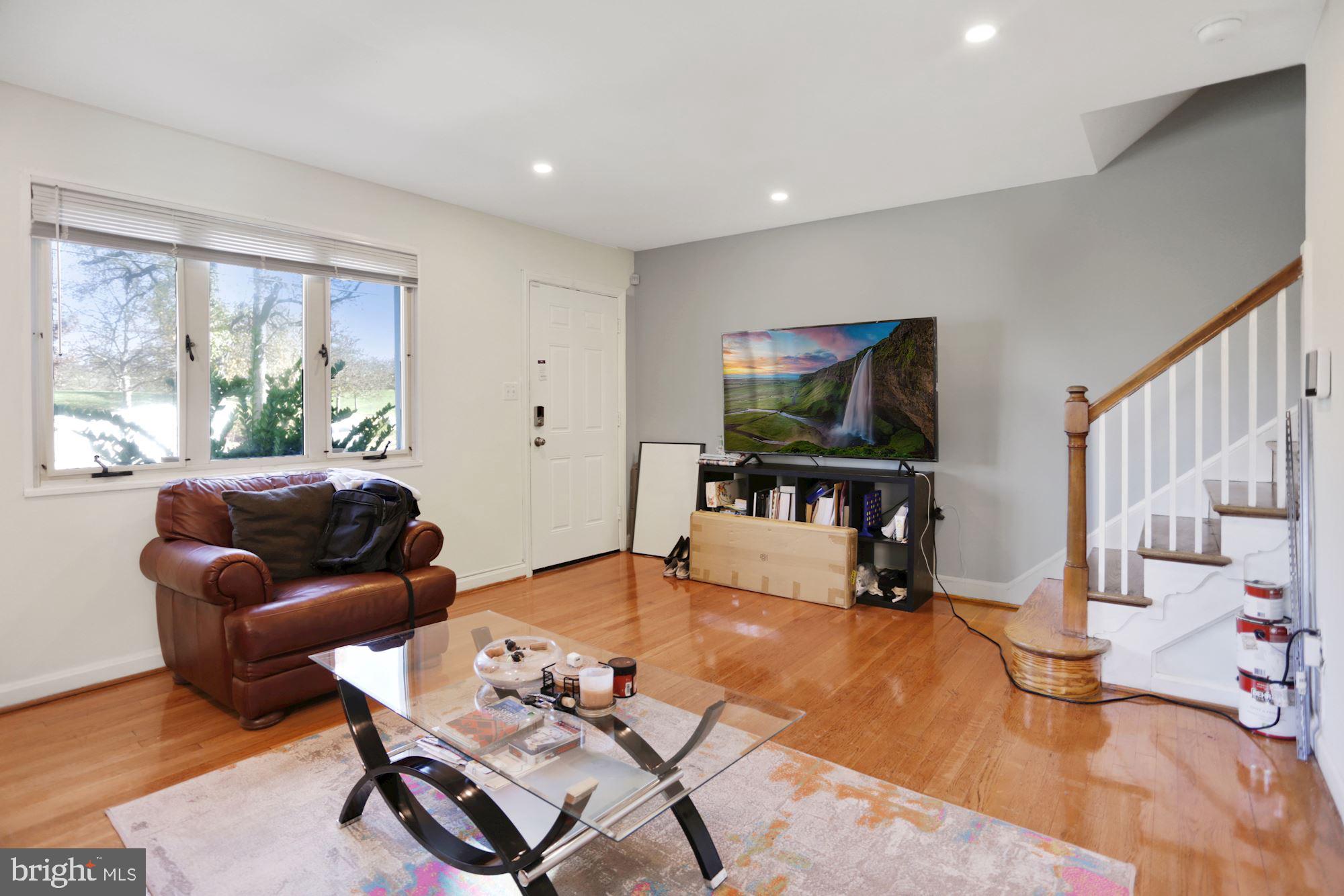 4910 Sargent Road Northeast Washington, DC 20017 - Photo 8 of 16 a living room with furniture and a flat screen tv