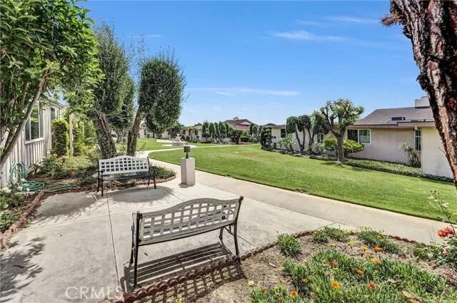 a view of a patio with a table and chairs