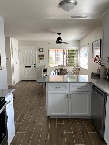 a kitchen with a sink stove and refrigerator