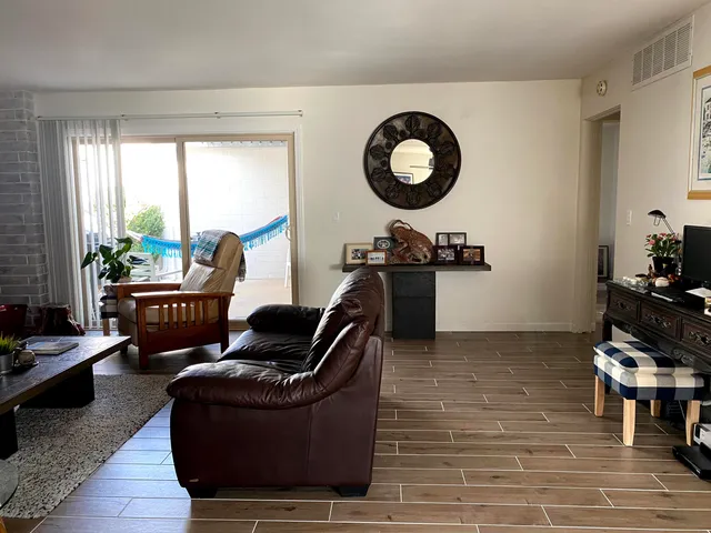 a living room with furniture and a large window