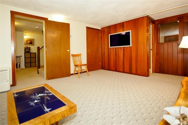 11 Tricorne Road Lexington, MA 02421 - Photo 13 of 15 a bed room with a bed and a television