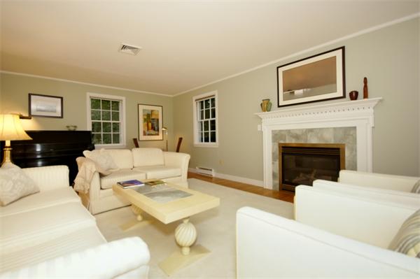 11 Tricorne Road Lexington, MA 02421 - Photo 5 of 15 a living room with furniture and a fireplace