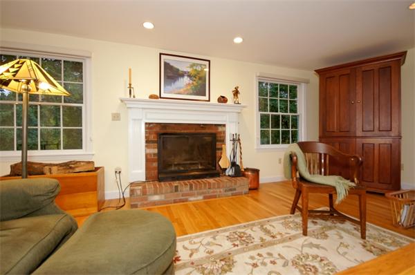 11 Tricorne Road Lexington, MA 02421 - Photo 9 of 15 a living room with furniture and a fireplace