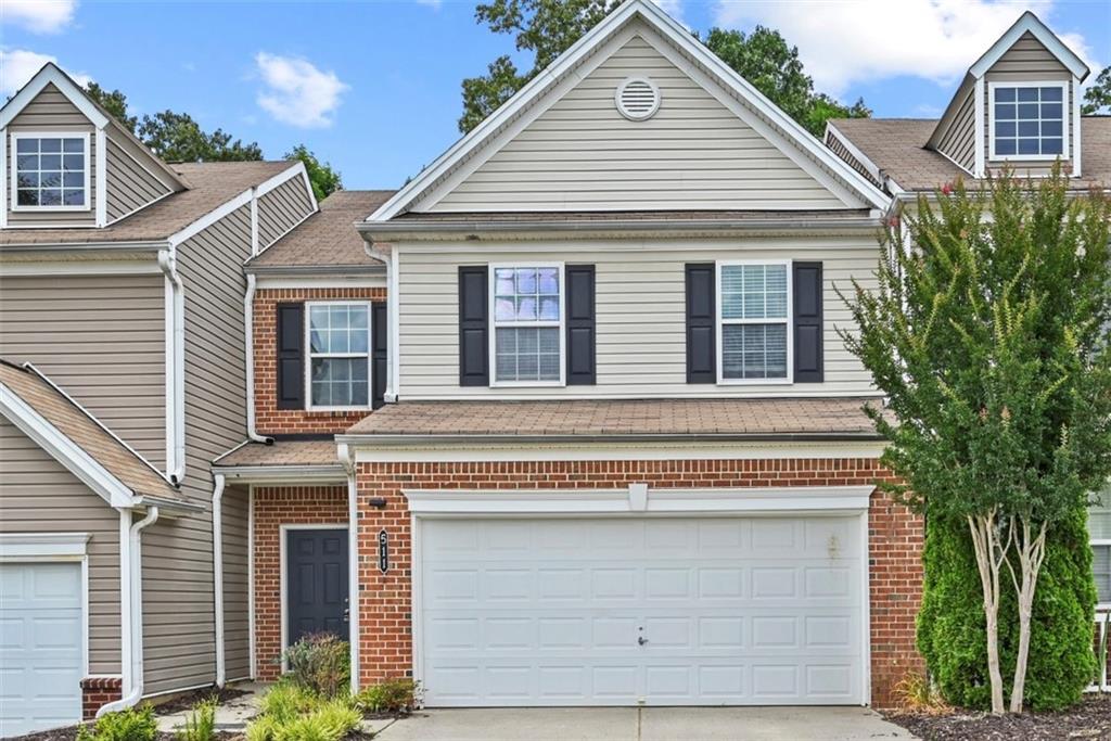 a front view of a house with a garage