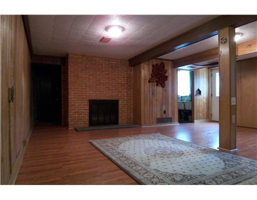 9321 Pannier Road Pittsburgh, PA 15237 - Photo 7 of 14 Den/Family/Great Room. Large family room with brick fireplace opens to the outside and the inground swimming pool with waterfall.