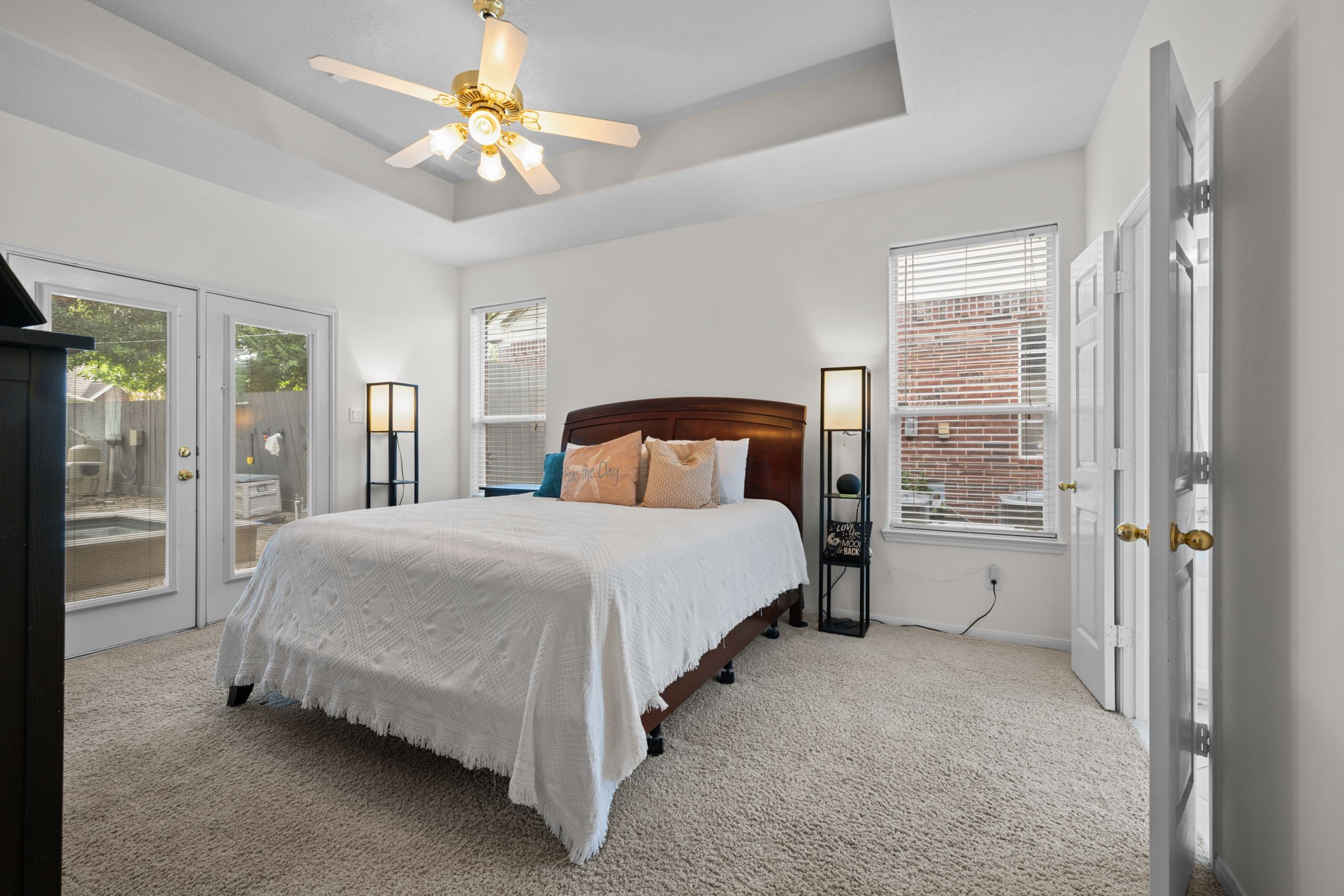 19114 Emory Trail Spring, TX 77388 - Photo 20 of 44 a spacious bedroom with a bed and a chandelier