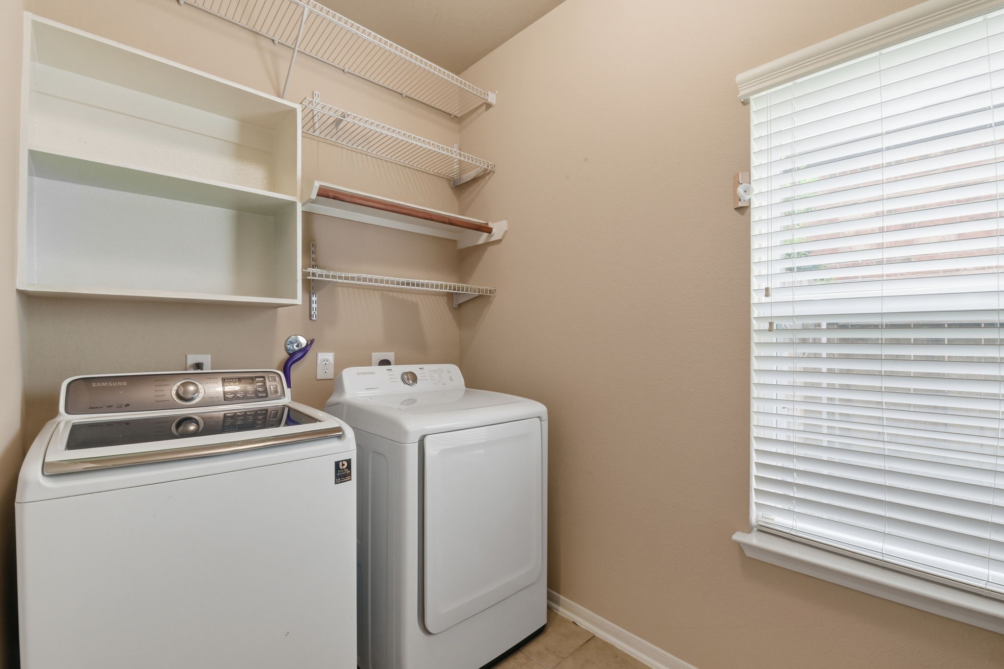 29019 Comal Karst Drive Spring, TX 77386 - Photo 11 of 50 a utility room with dryer and washer