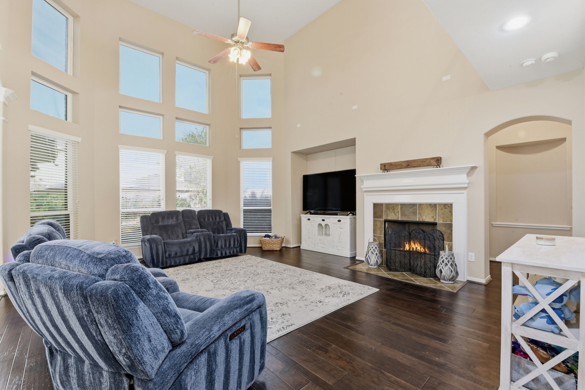 29019 Comal Karst Drive Spring, TX 77386 - Photo 16 of 50 a living room with furniture a flat screen tv and a fireplace