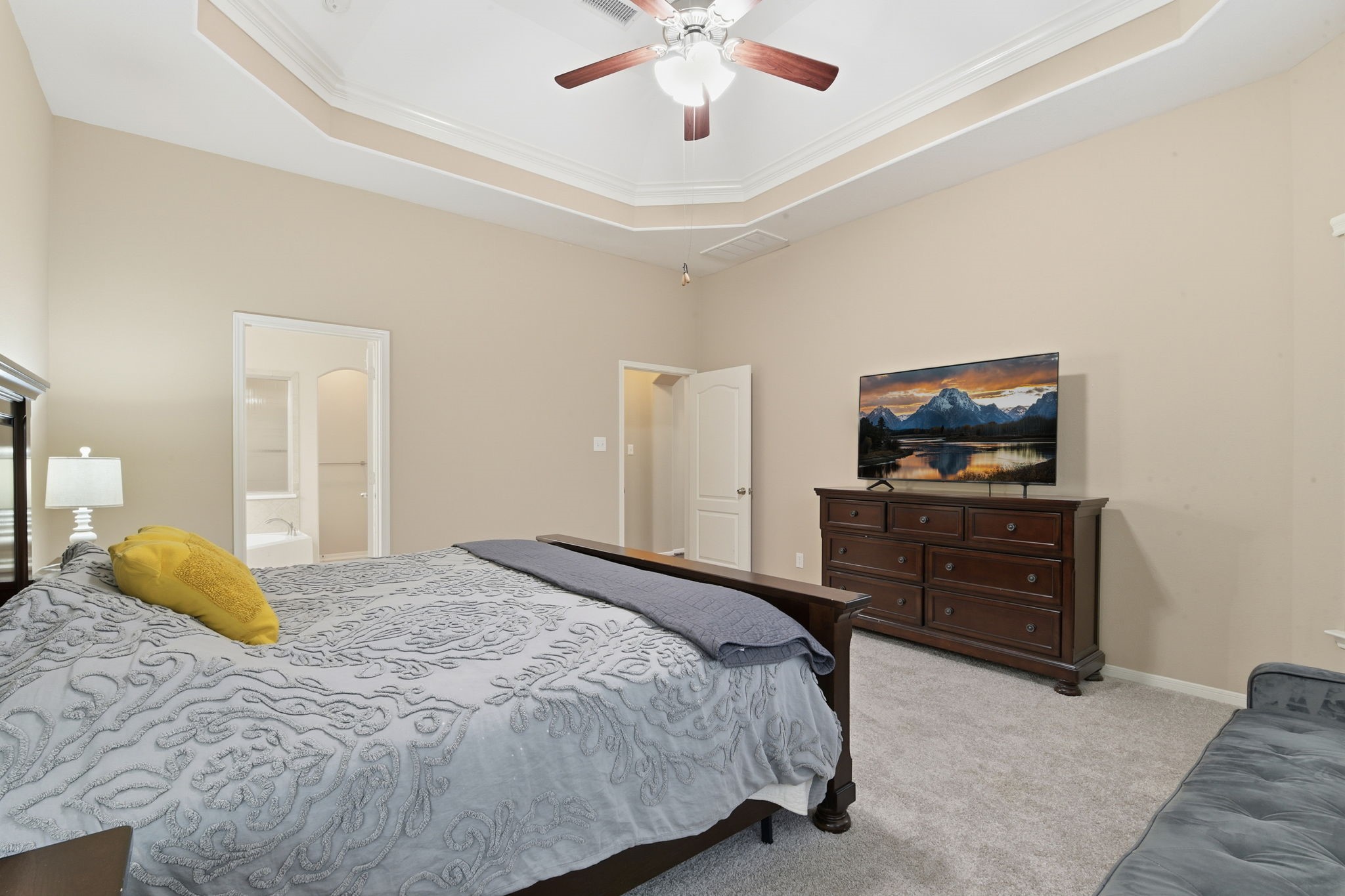 29019 Comal Karst Drive Spring, TX 77386 - Photo 26 of 50 a bedroom with a bed and a tv on dresser