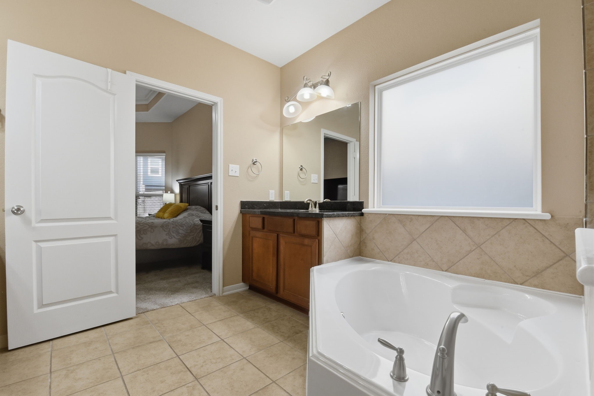 29019 Comal Karst Drive Spring, TX 77386 - Photo 29 of 50 a en suite bathroom with a sink and a mirror