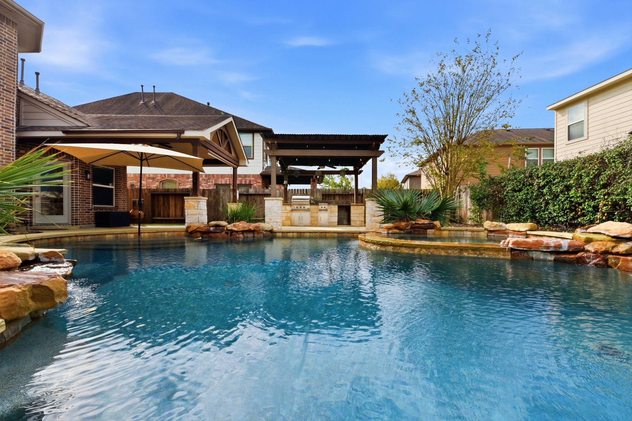 29019 Comal Karst Drive Spring, TX 77386 - Photo 4 of 50 a view of a lake with a building in the background