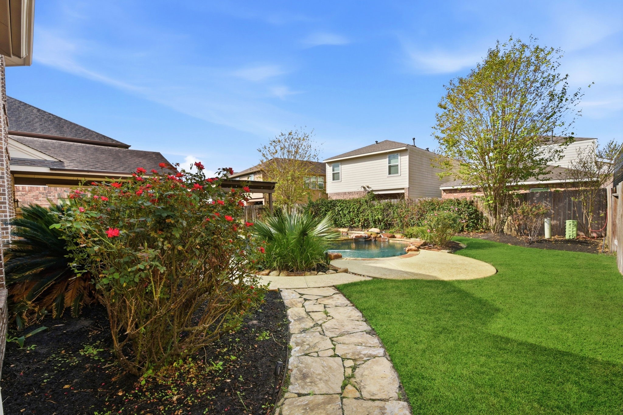 29019 Comal Karst Drive Spring, TX 77386 - Photo 48 of 50 a view of a house with a backyard and a garden