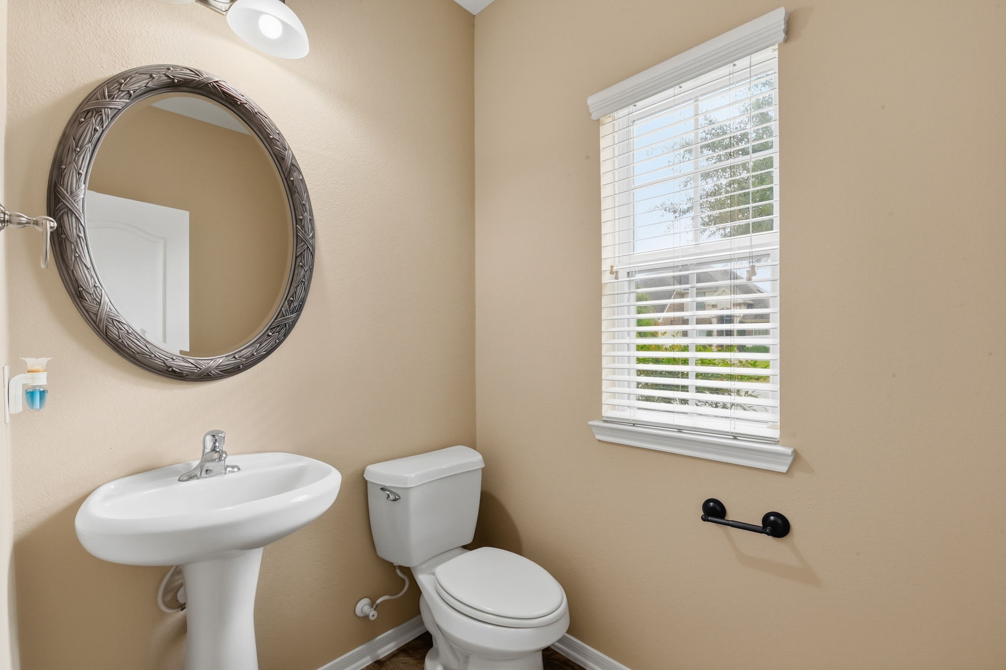 29019 Comal Karst Drive Spring, TX 77386 - Photo 8 of 50 a bathroom with a sink a toilet and a mirror
