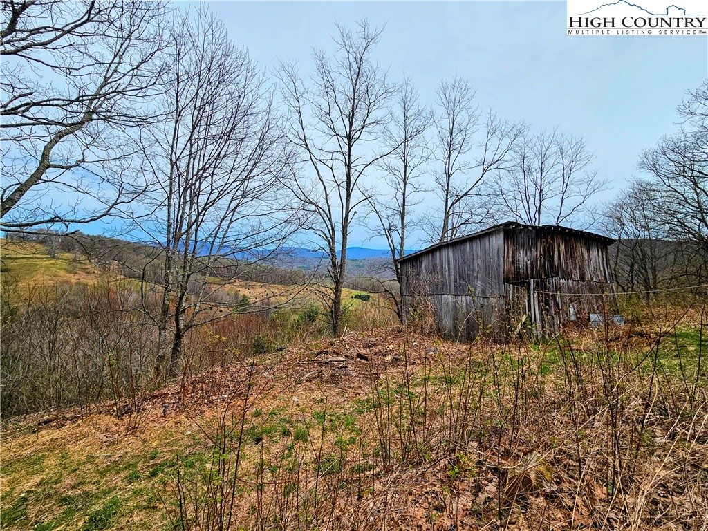 851 East Whenlin Ridge Road Lansing, NC 28643 - Photo 5 of 14 a view of backyard with wooden fence