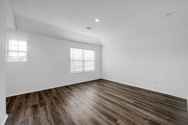 a view of a kitchen with a sink and a stove top oven