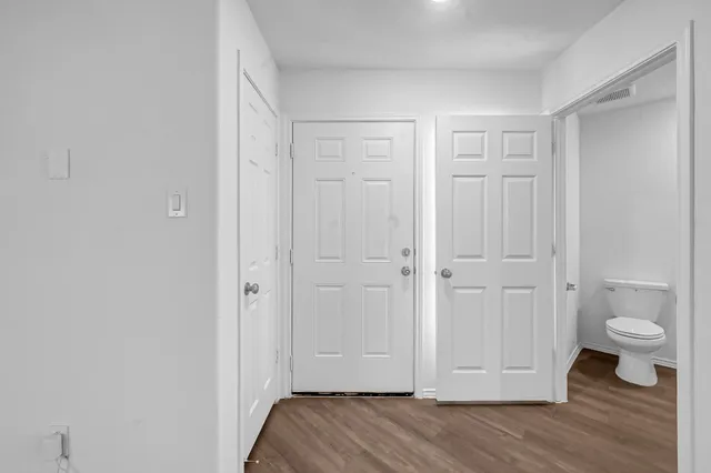 a view of room with wooden floor