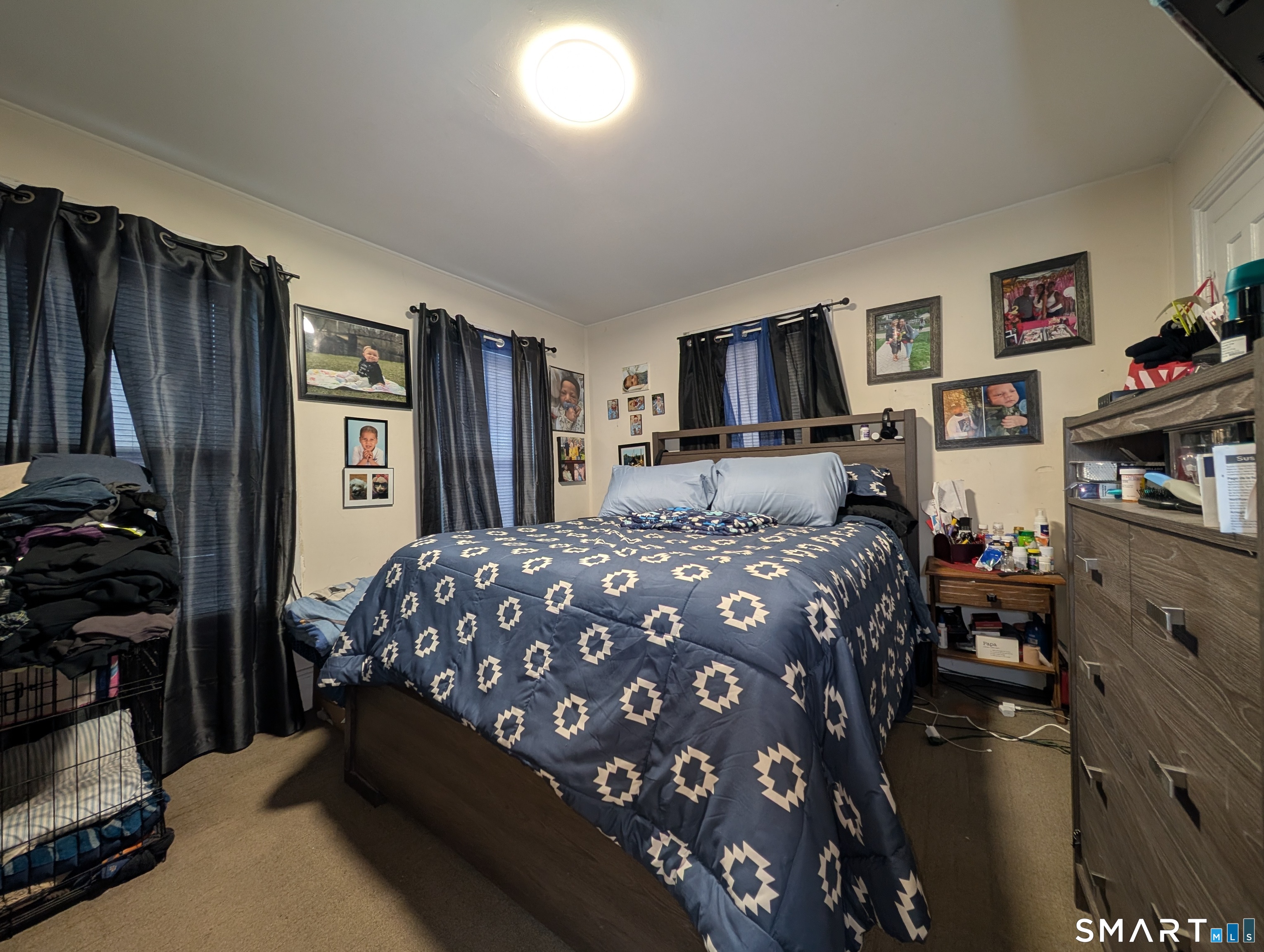 188 Holly Street Bridgeport, CT 06607 - Photo 17 of 33 a bedroom with a dresser and a book shelf