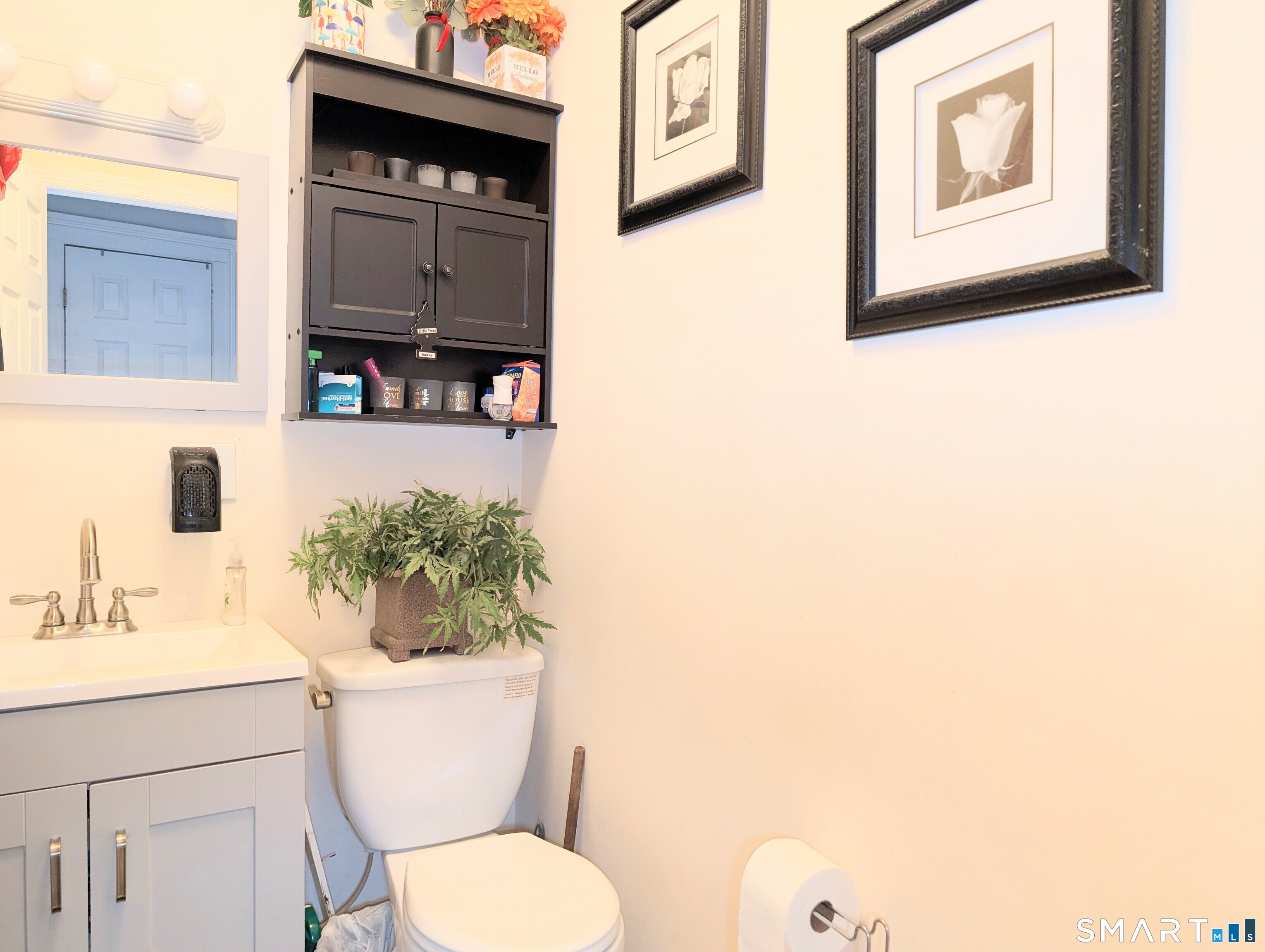 188 Holly Street Bridgeport, CT 06607 - Photo 19 of 33 a bathroom with a toilet a sink and mirror