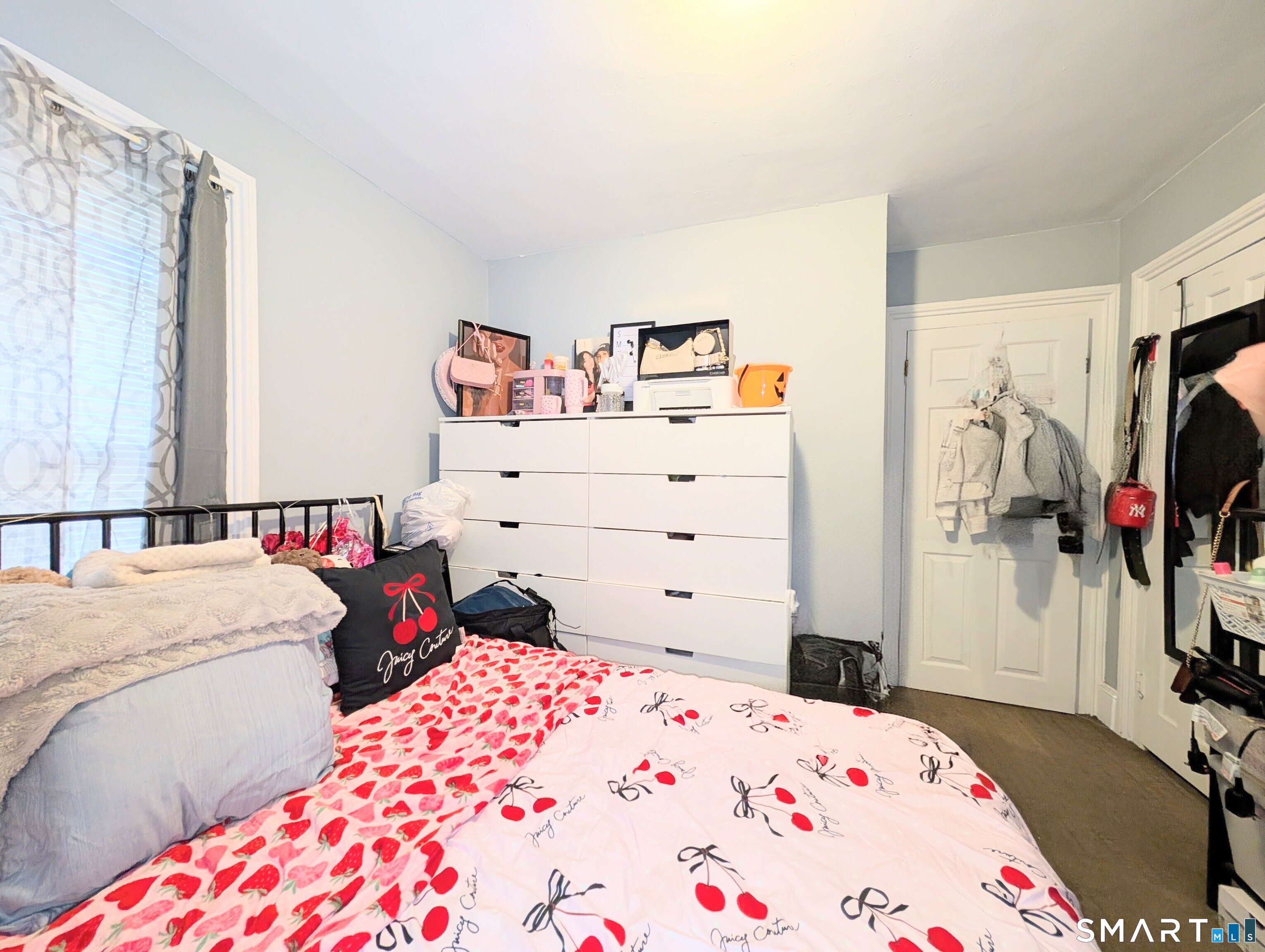 188 Holly Street Bridgeport, CT 06607 - Photo 22 of 33 a bedroom with a bed and a flat screen tv