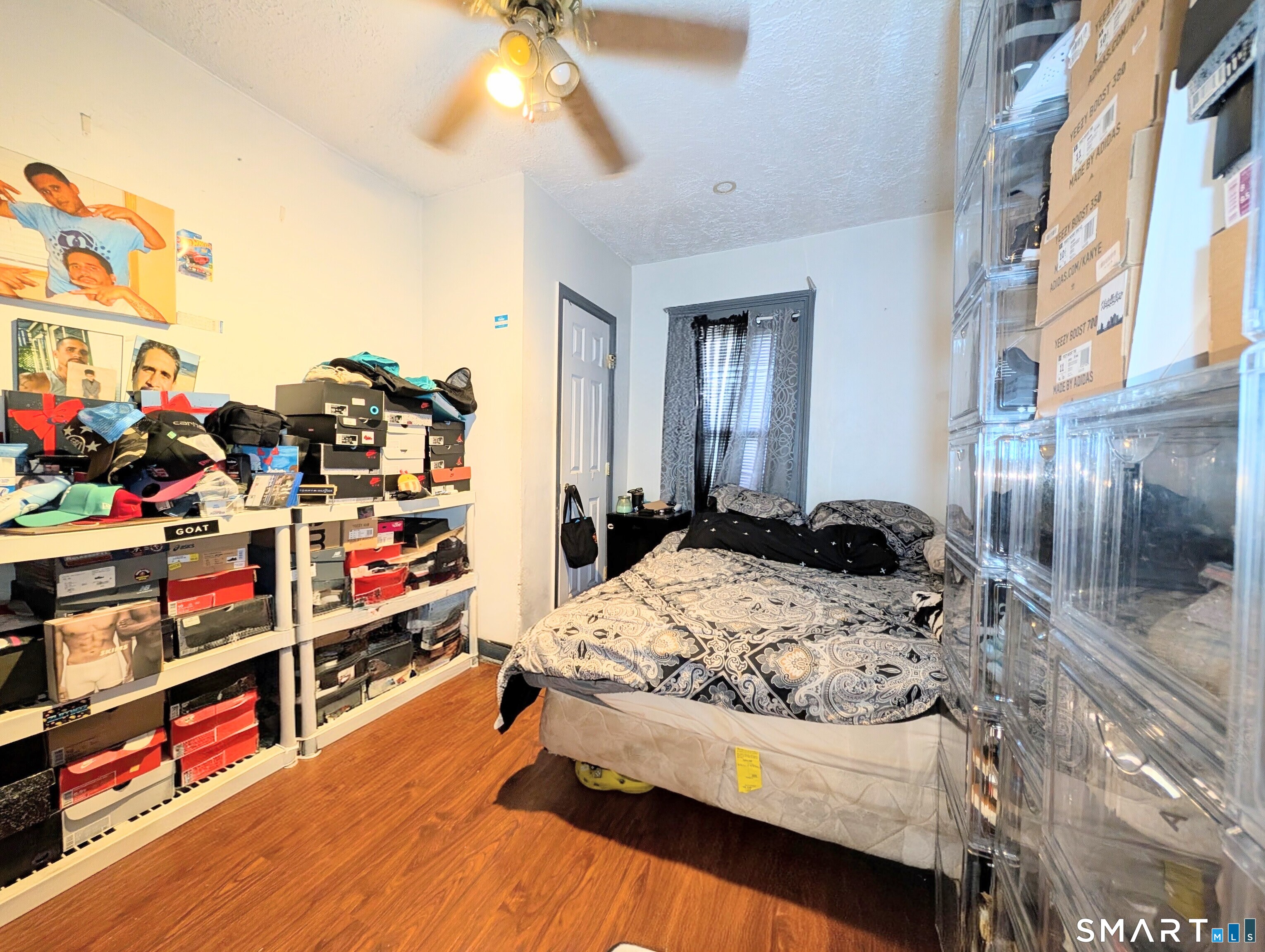 188 Holly Street Bridgeport, CT 06607 - Photo 24 of 33 a bedroom with bed and a chandelier