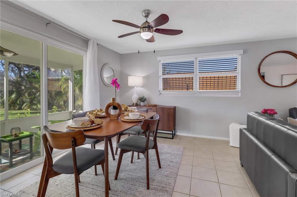 751 100th Avenue North Naples, FL 34108 - Photo 17 of 34 a view of a dining room with furniture window and outside view